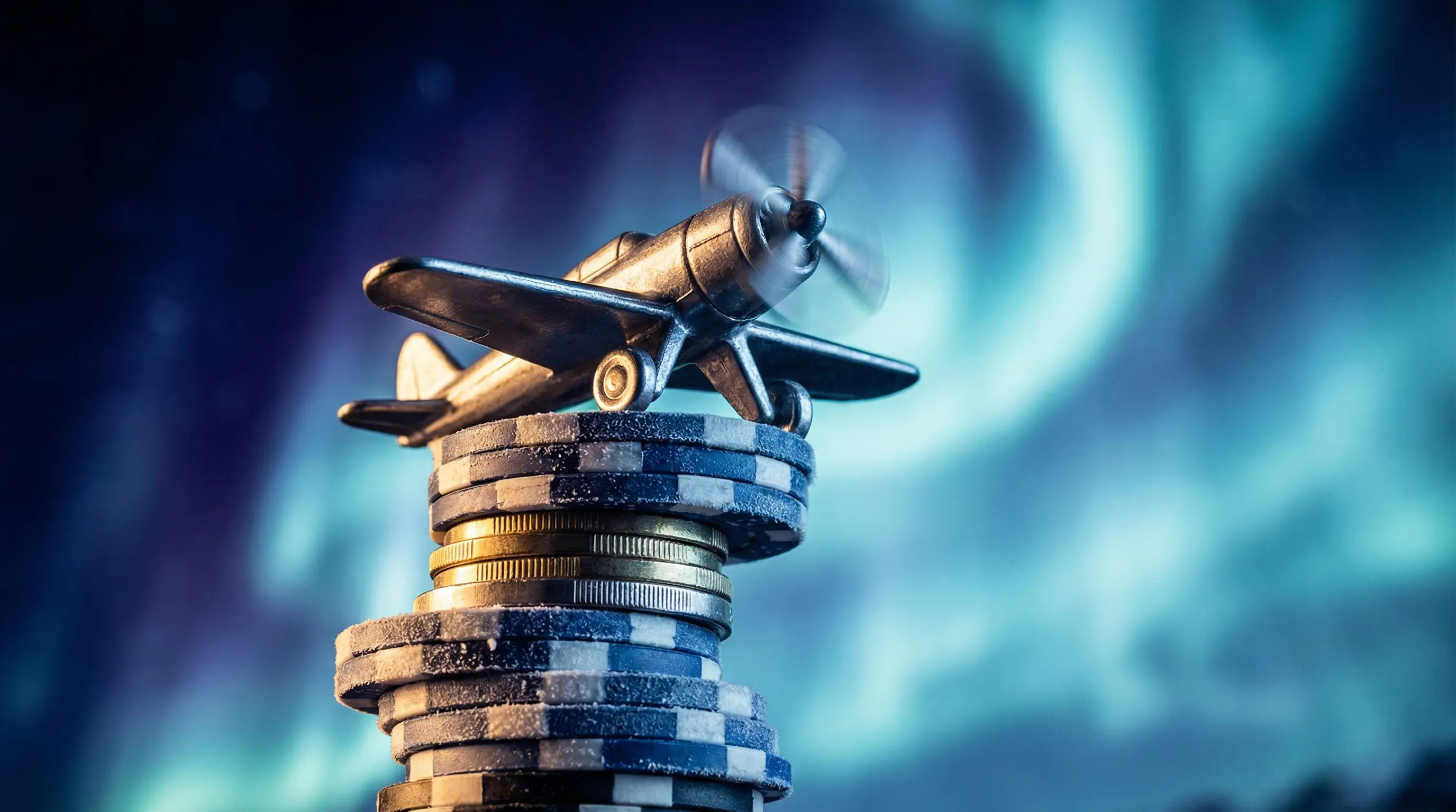 Spielzeugflugzeug steigt über Casino-Chips auf
